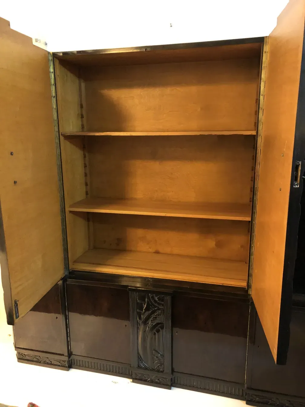antique bookcase with several shelves and an elegant design