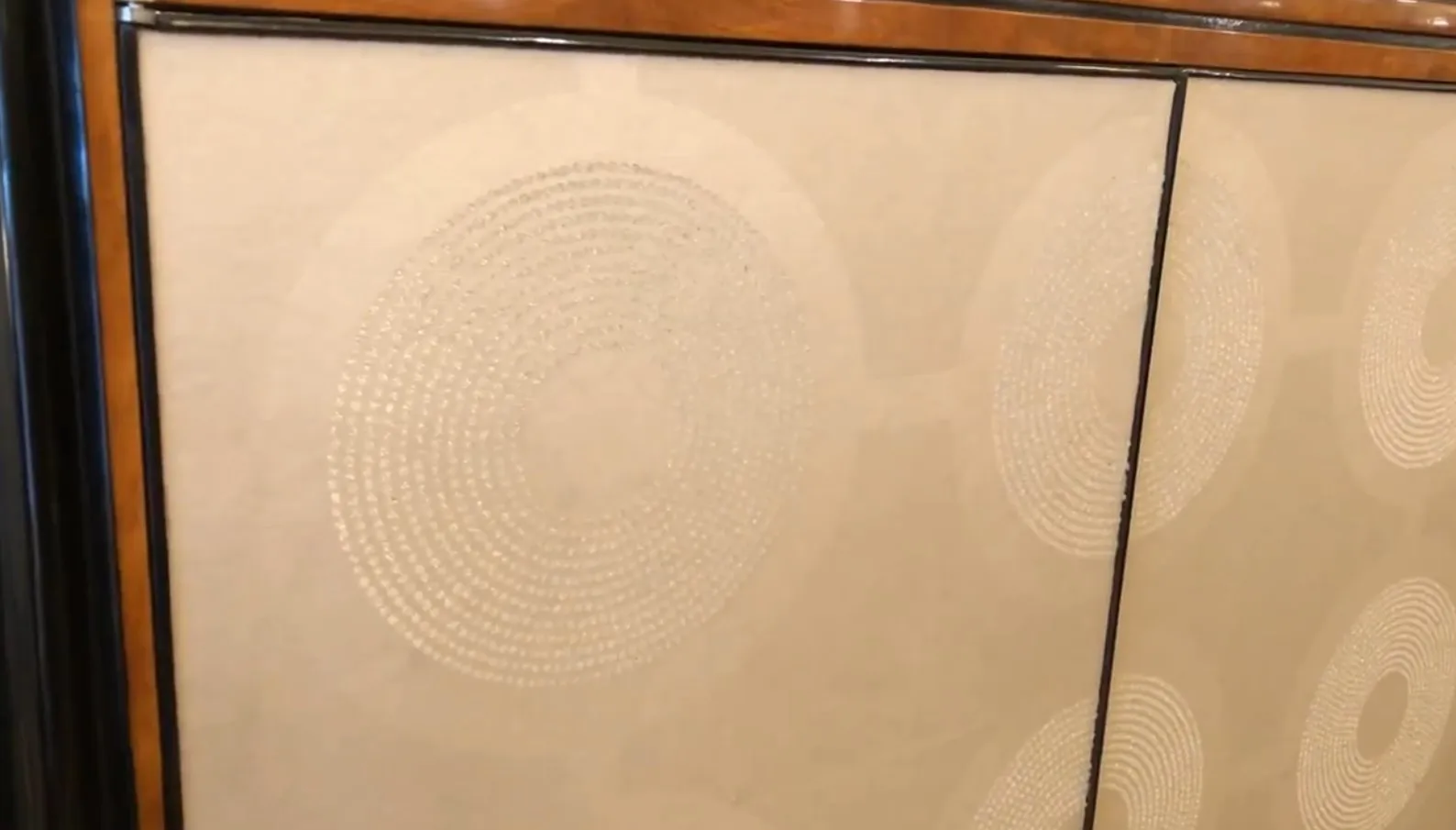 antique bookcase with subtle circular patterns