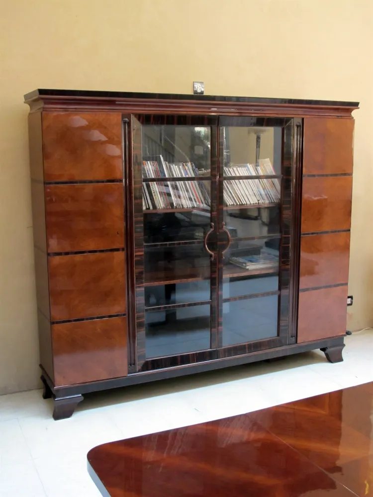 antique bookcase with shelves and visible books