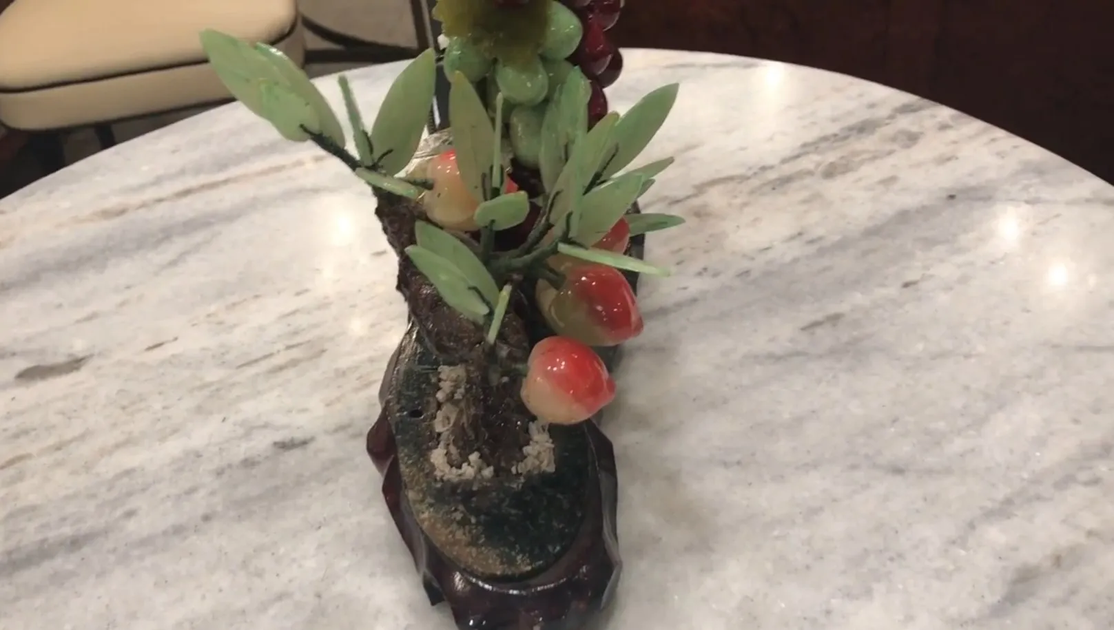 Handcrafted bonsai decorated with colorful leaves and fruits