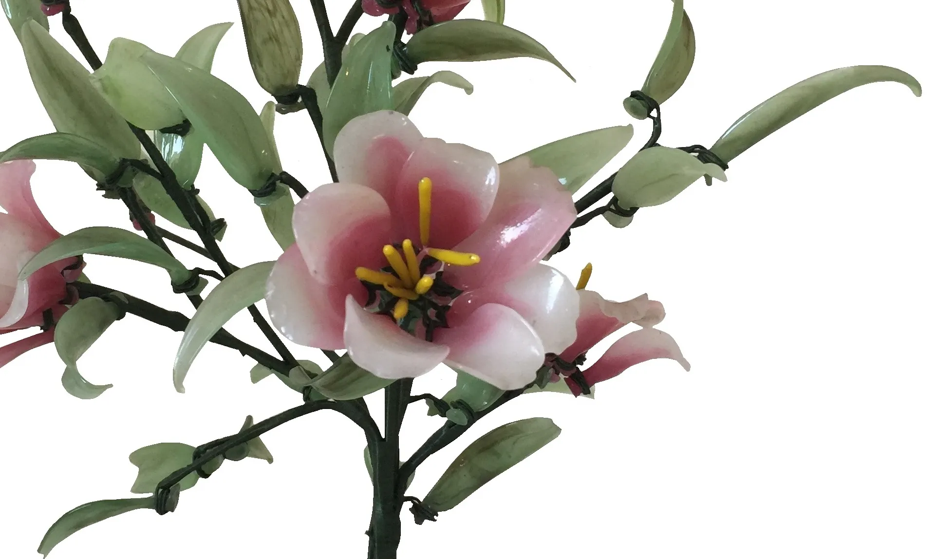 Antique bonsai with pink flowers and green leaves