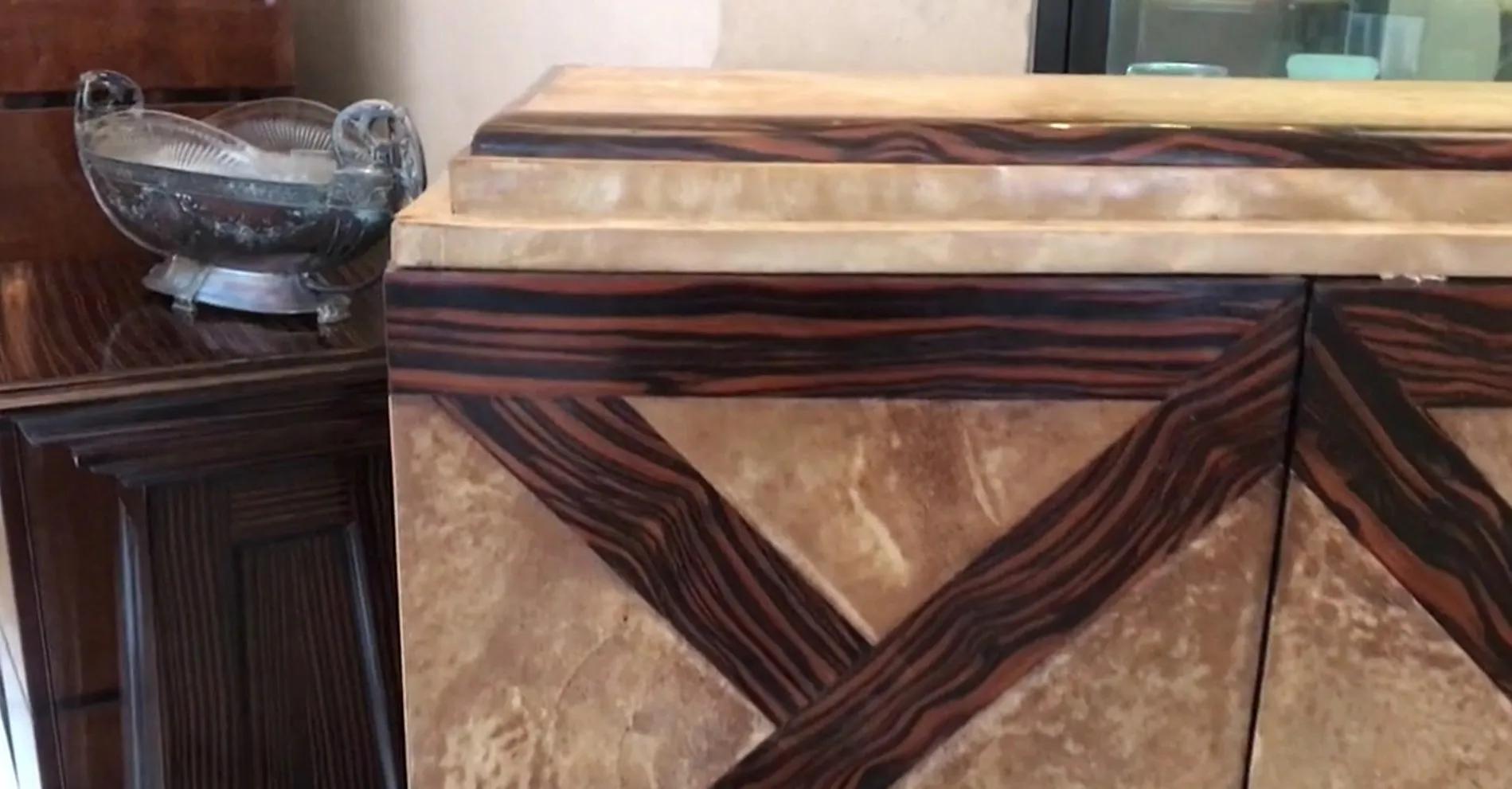 Antique bar cabinet with unique decorative details and elegant ambiance.