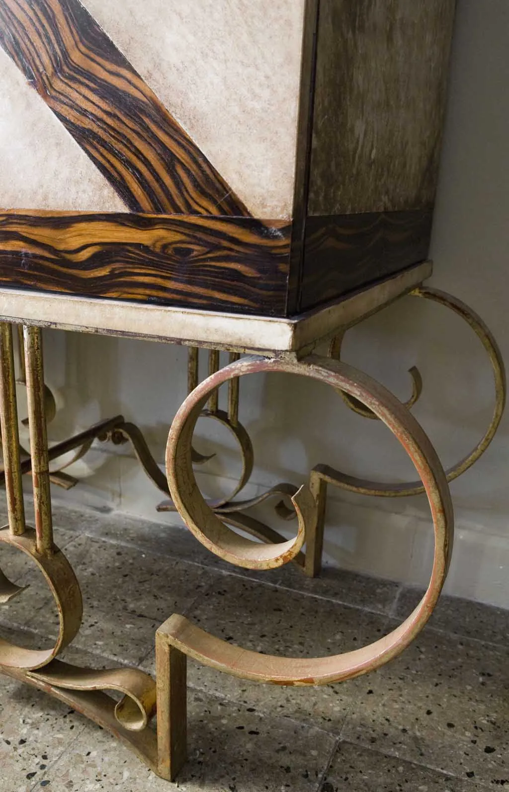Antique bar cabinet with decorative legs and elegant design.