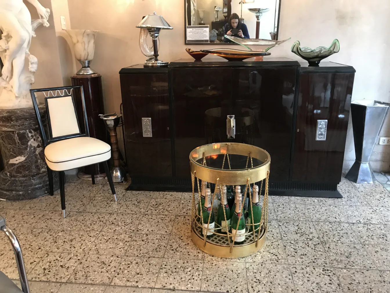 Elegant antique bar with bottles and decorations.