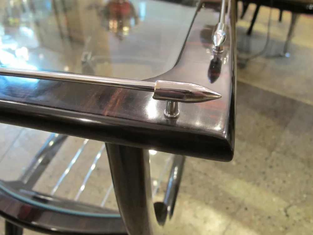Antique bar furniture with shiny metal details in an elegant setting.