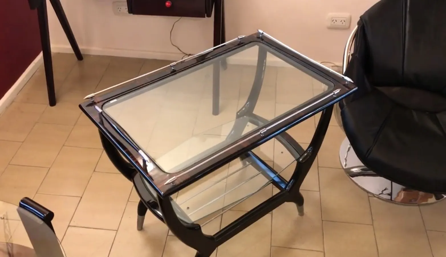 Antique bar furniture with a glass top in a modern setting.