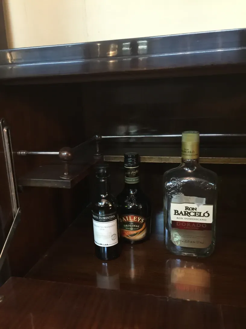Antique bar with liquor bottles inside