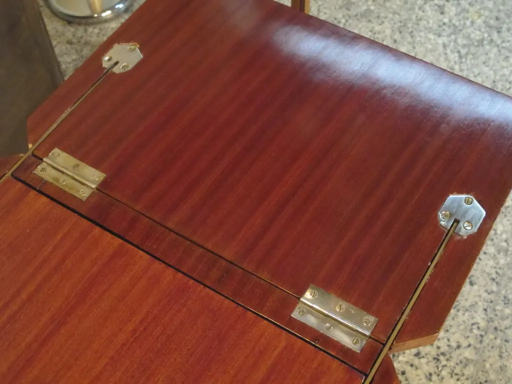 Antique bar cabinet with wooden finish details