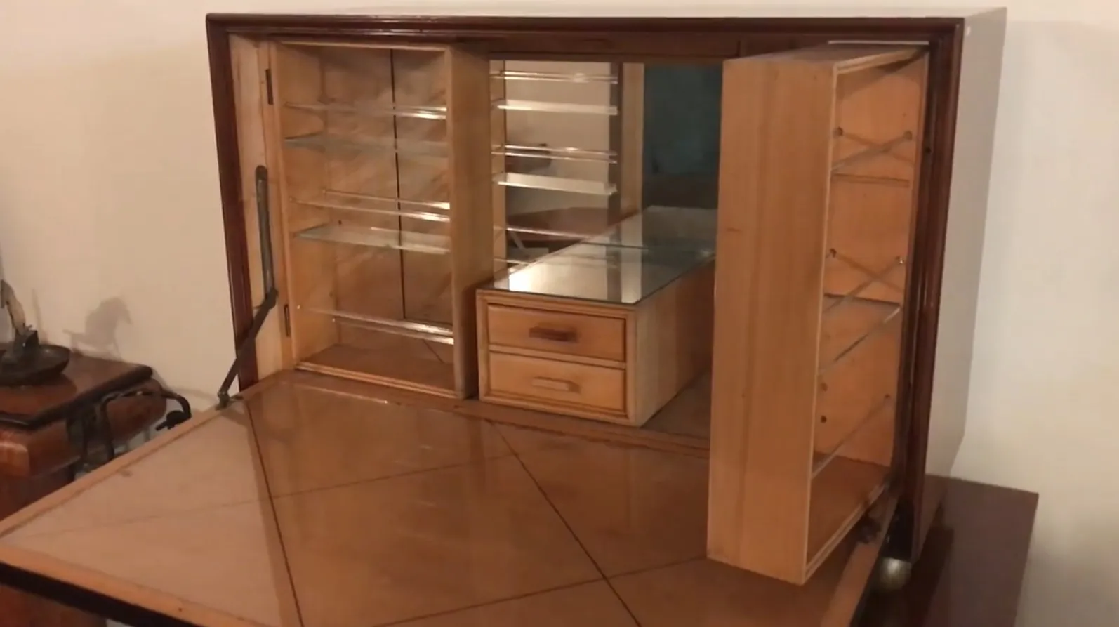 Antique bar cabinet with shelves and small drawers, stylish