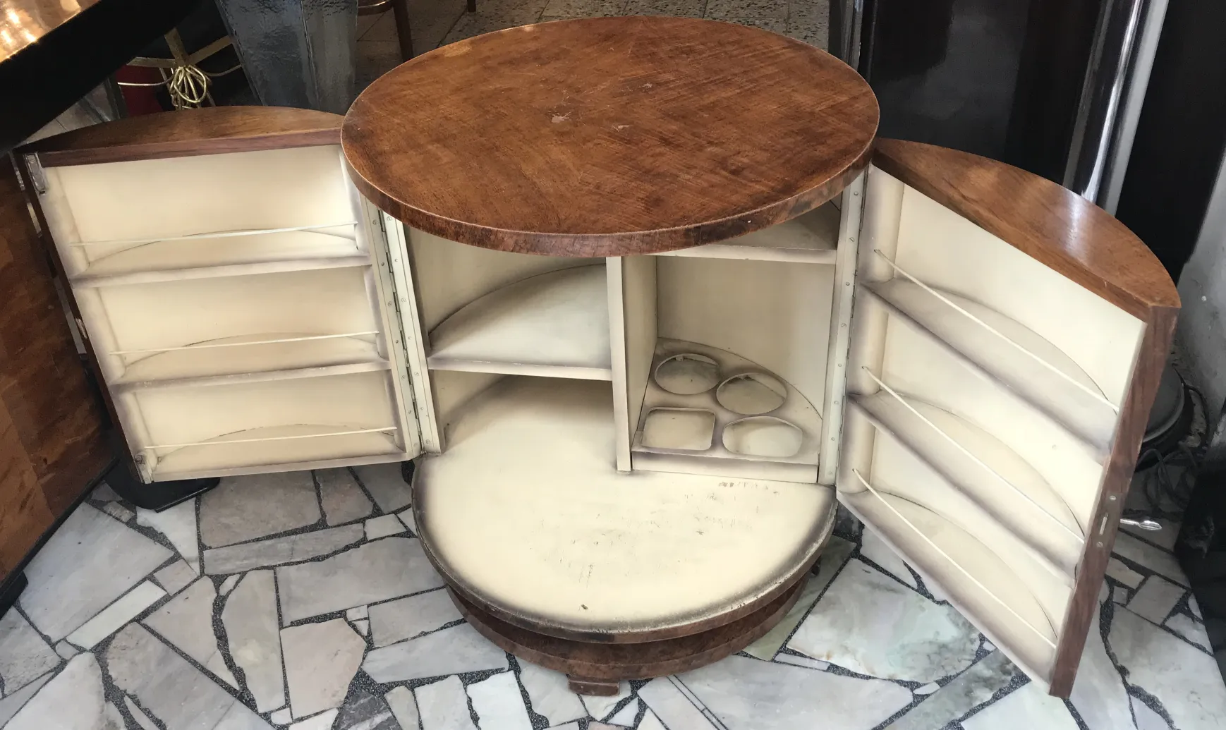 Antique round bar cabinet with spacious compartments.