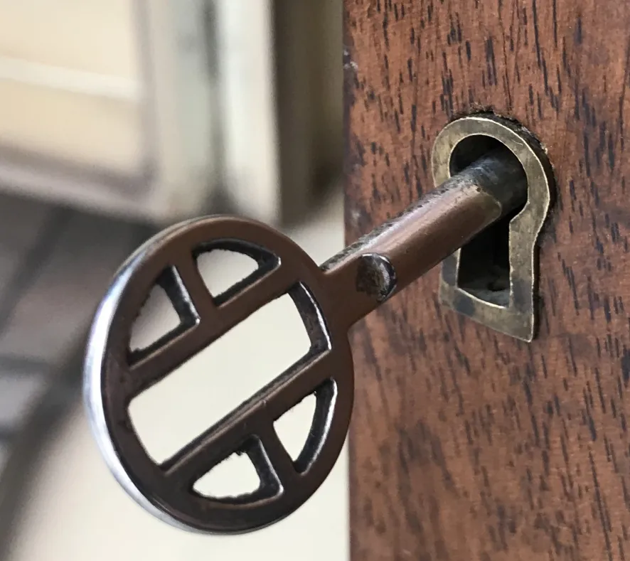 Antique key for a bar cabinet lock