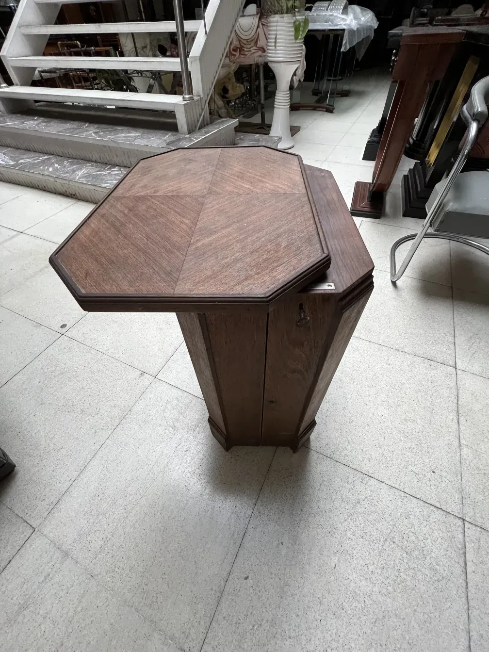 Octagonal bar cabinet in an antique setting