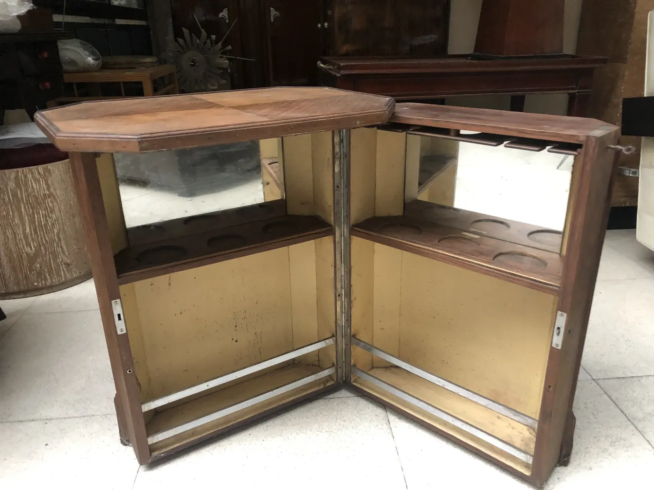 Antique bar with mirrors in a cozy setting.