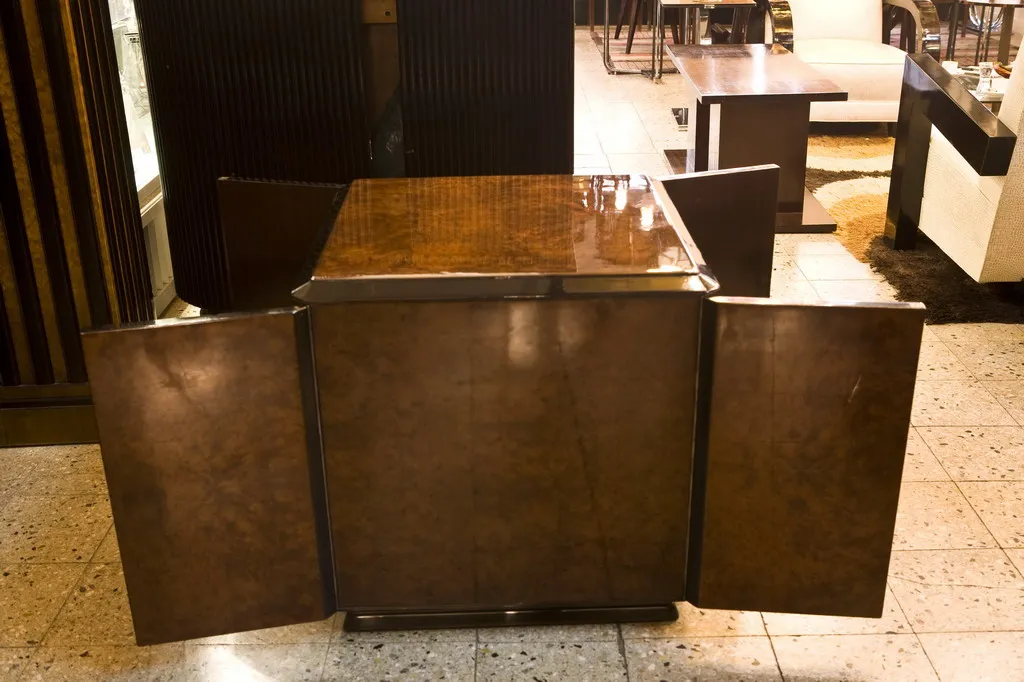 Antique bar cabinet with side doors in a dining setting