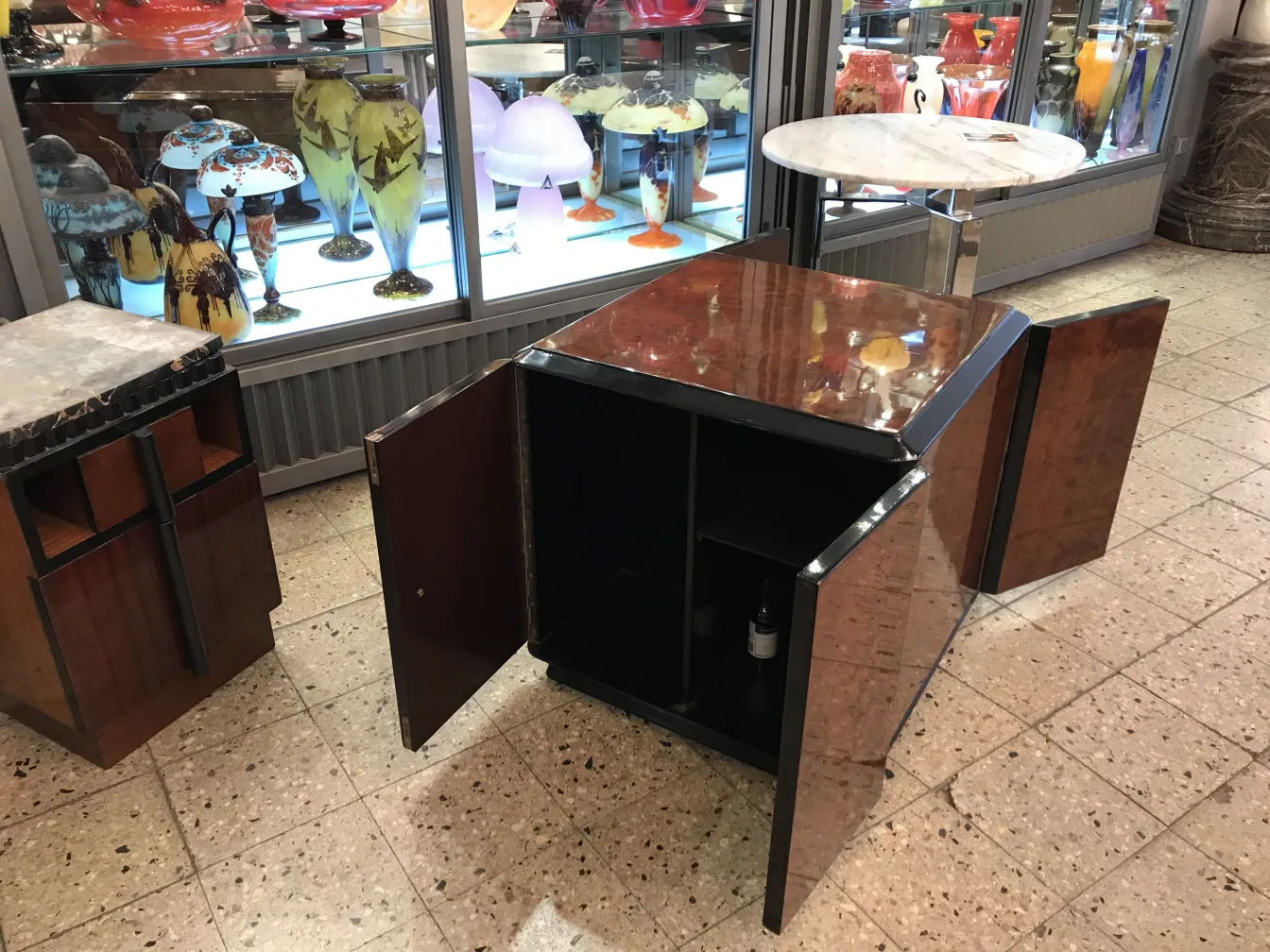 Antique bar cabinet with open doors in a classic setting