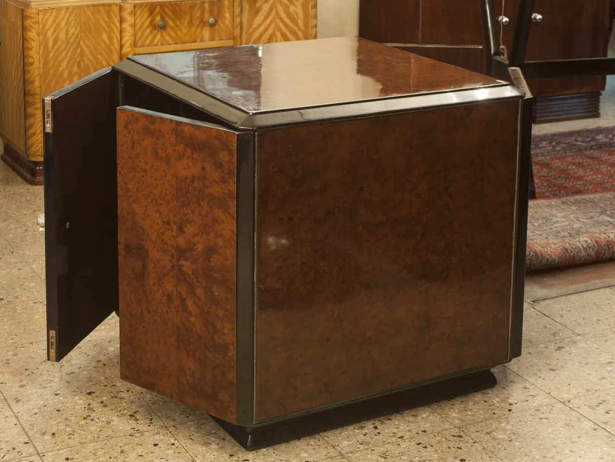 Vintage bar cabinet with a sleek design and side doors.