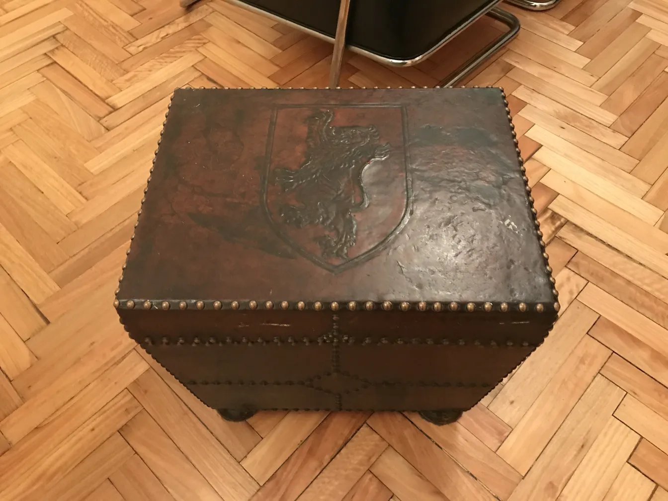 Antique bar with lion shield in a warm setting.