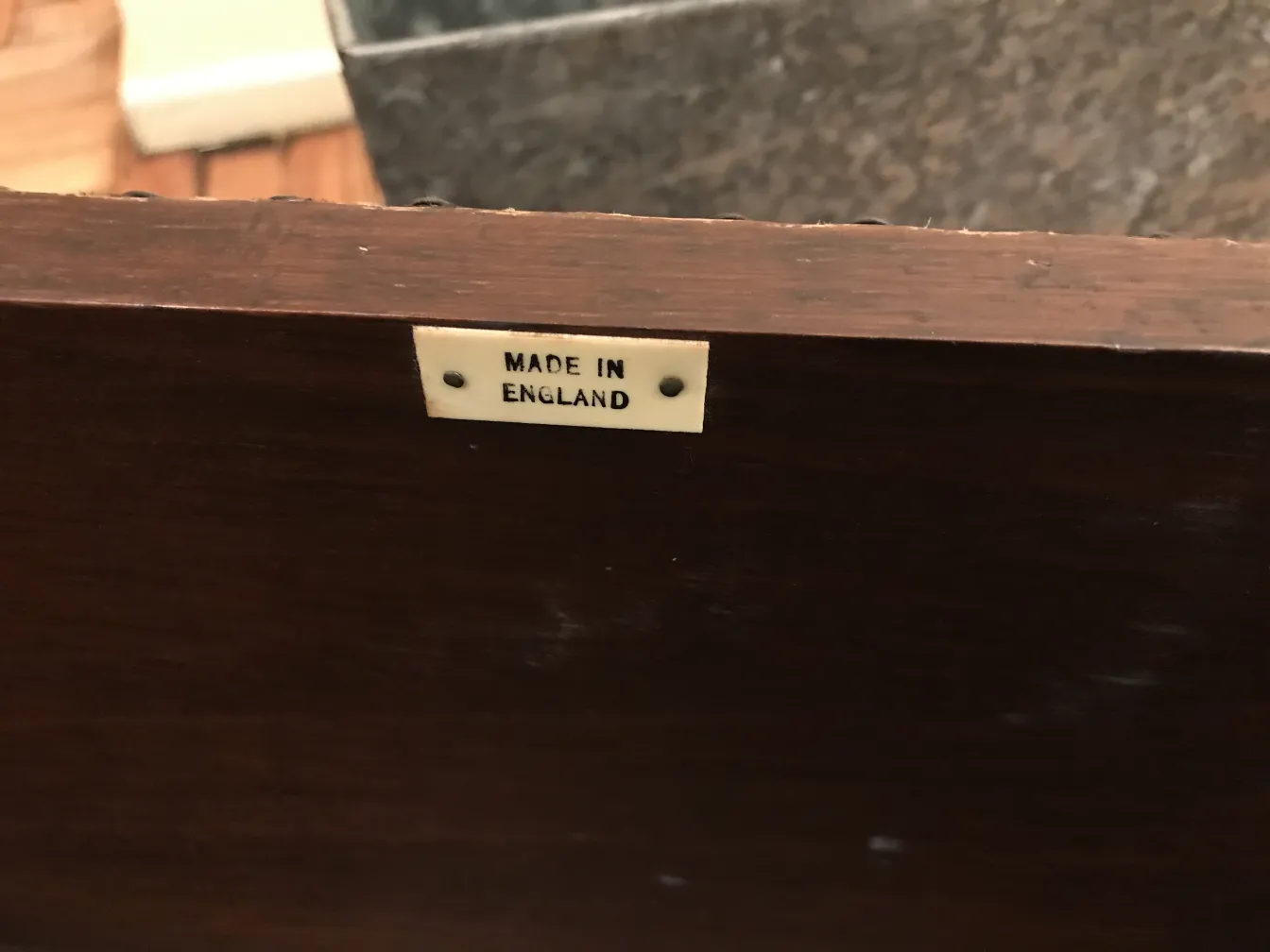 Antique bar cabinet made of wood with a manufacturing tag