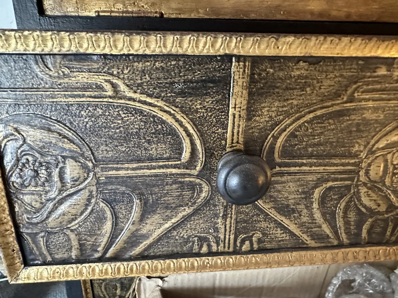Antique bar cabinet with artisan design and decorative carving