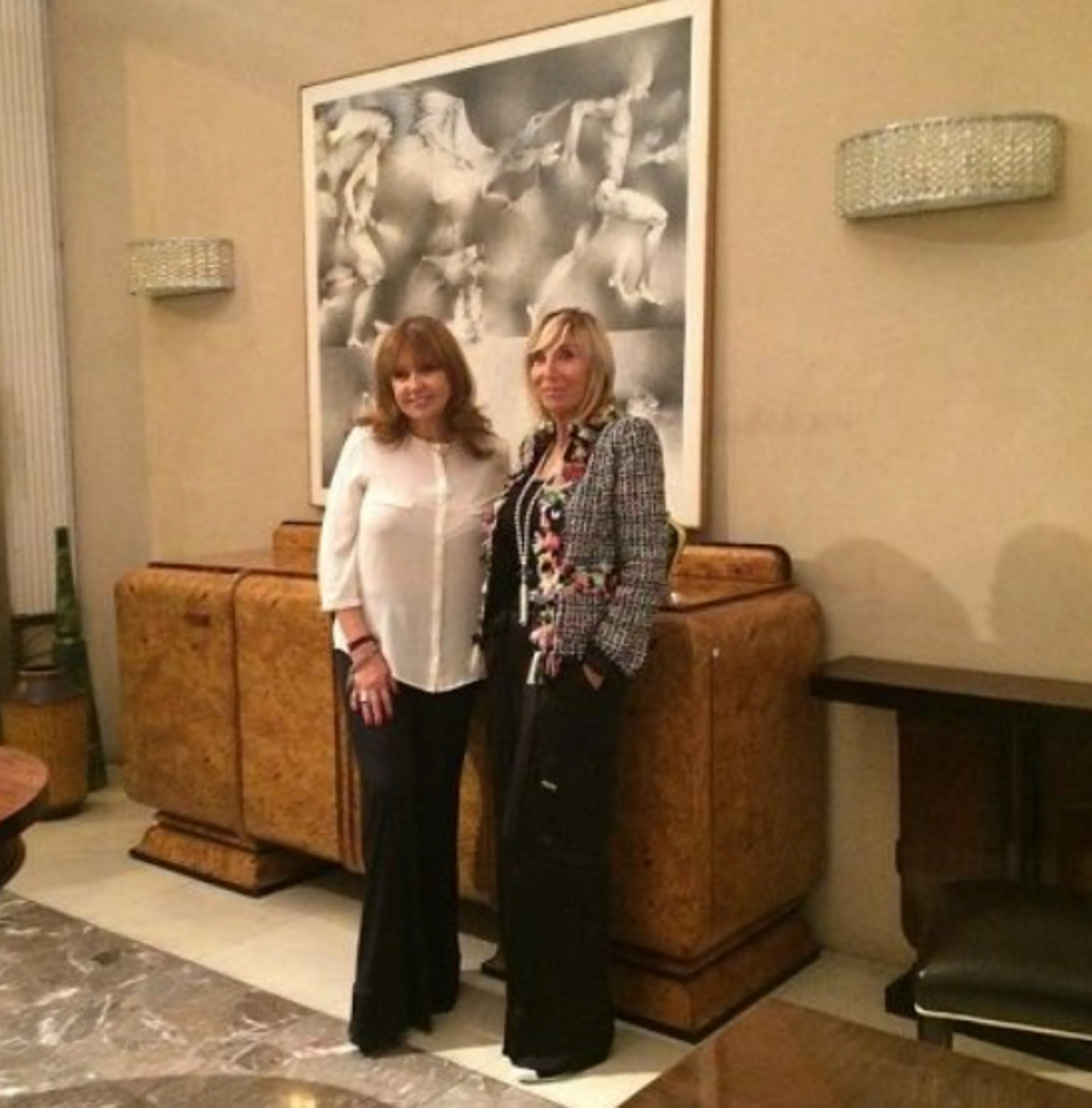 Antique pair of sconces with modern design in an elegant living room.