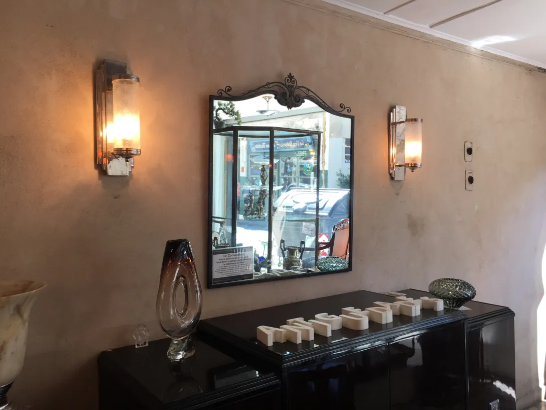 two antique sconces softly illuminating the environment