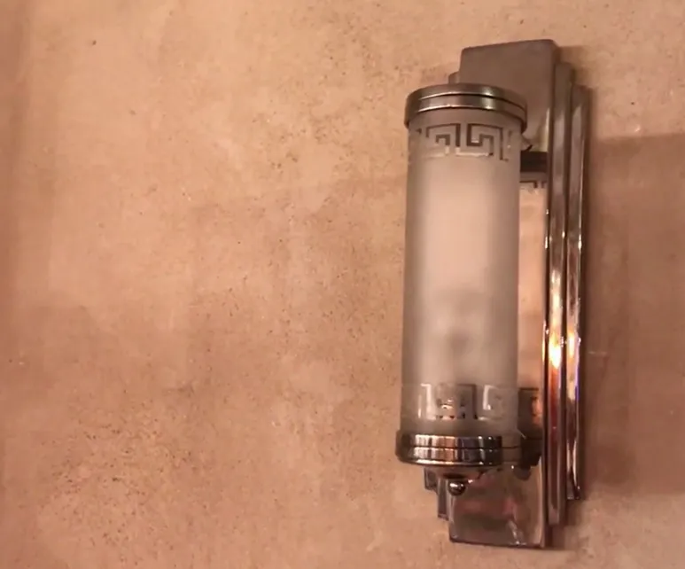 Pair of antique sconces featuring a classic finish