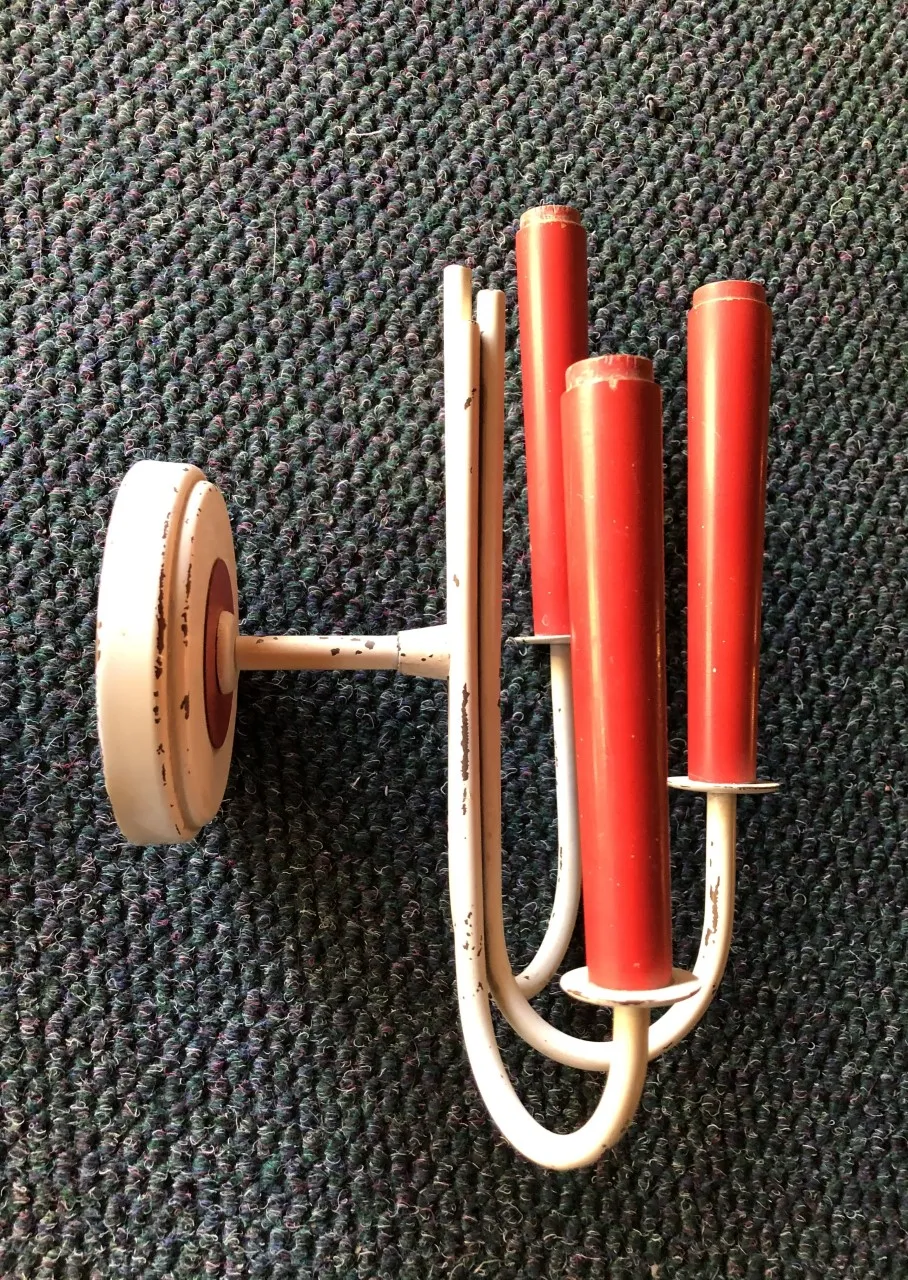 antique sconces with three red arms, elegant design