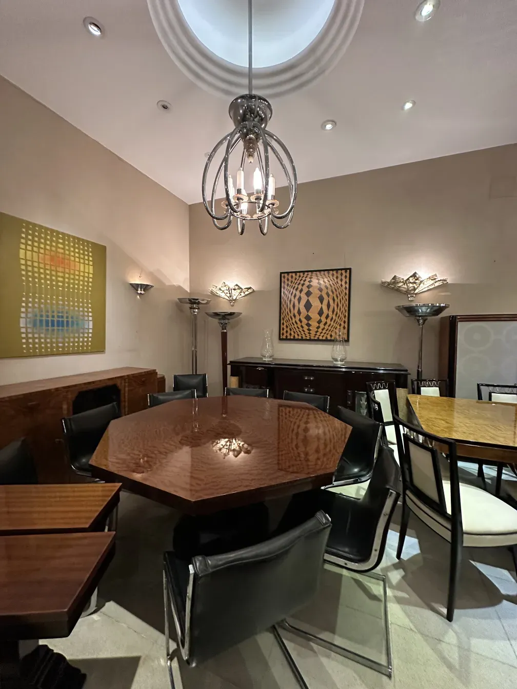 Antique sconces in an elegant setting with a wooden table