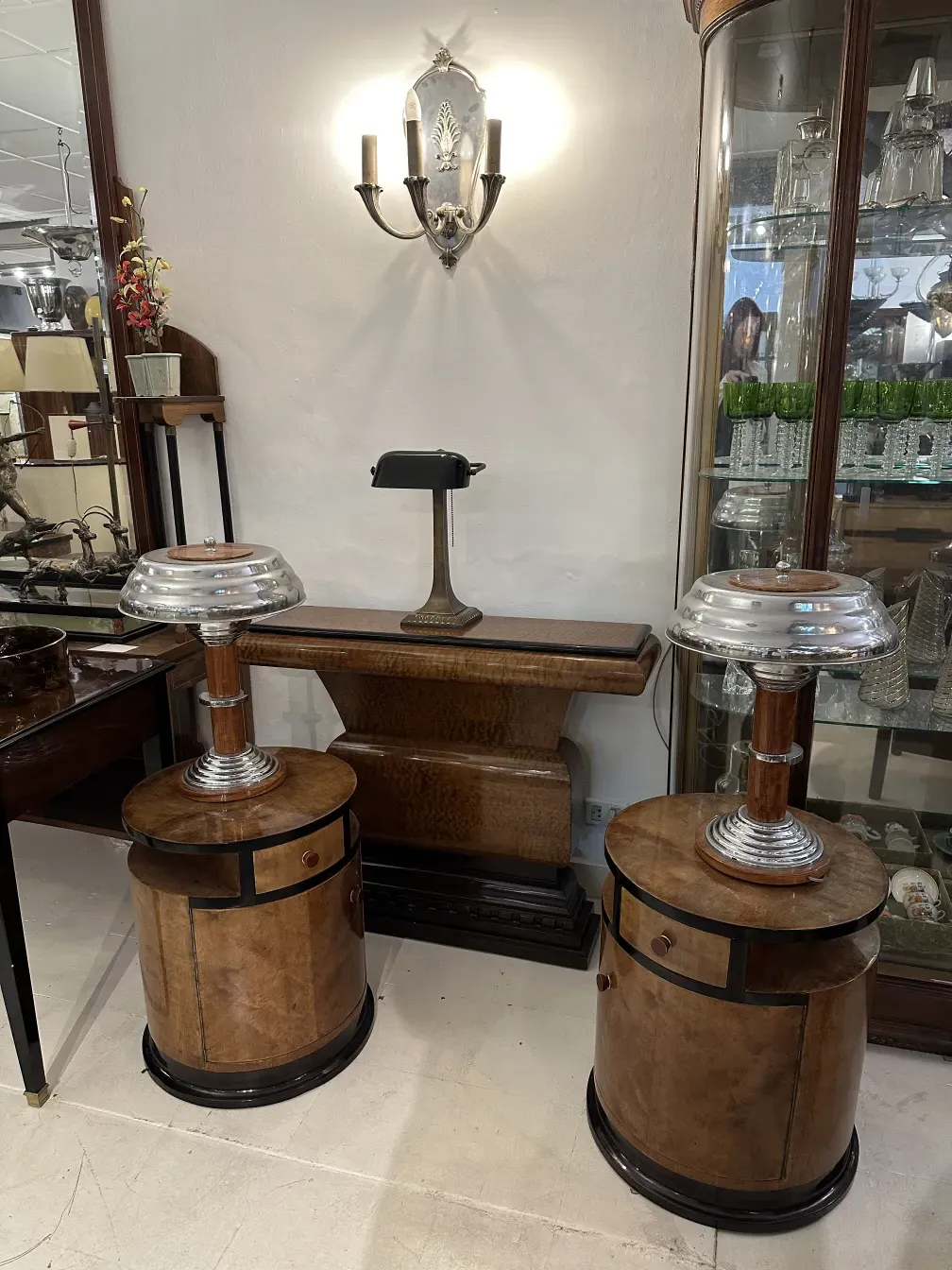 Antique sconces in a room with wooden furniture