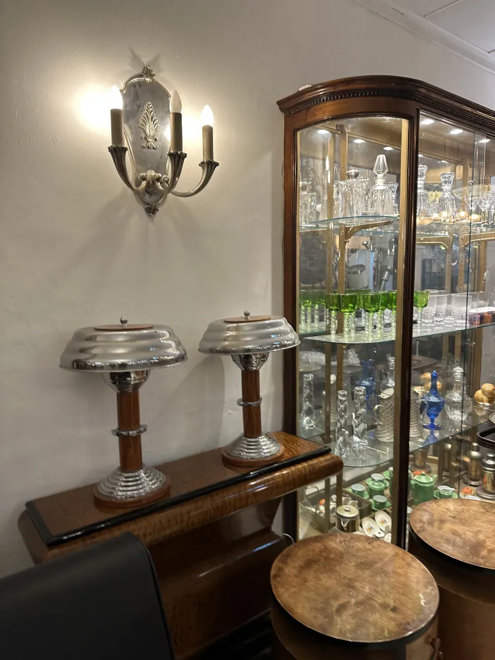 Antique pair of sconces featuring elegant design and warm light, suitable for classic decor.