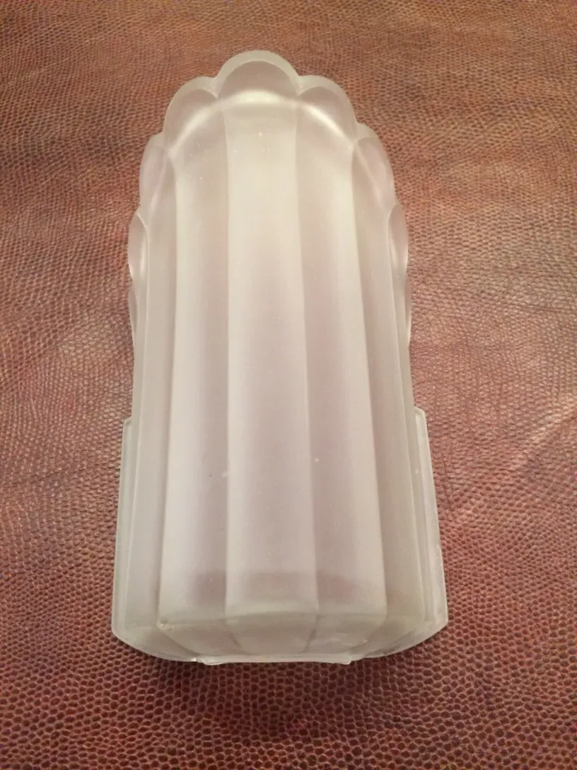 Pair of antique sconces featuring classic design in light tones, ideal for interior decor.