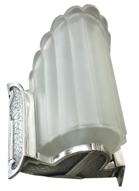 Antique wall sconces with embossed design and clear glass