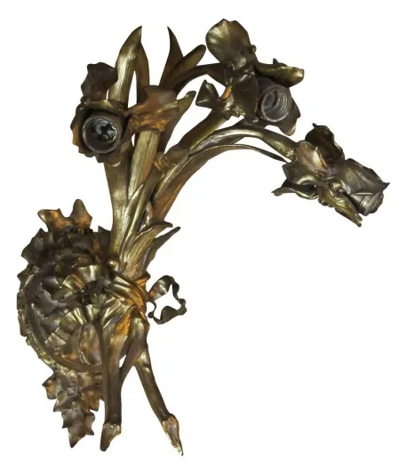 Elegant antique sconces with floral design, gold finish.