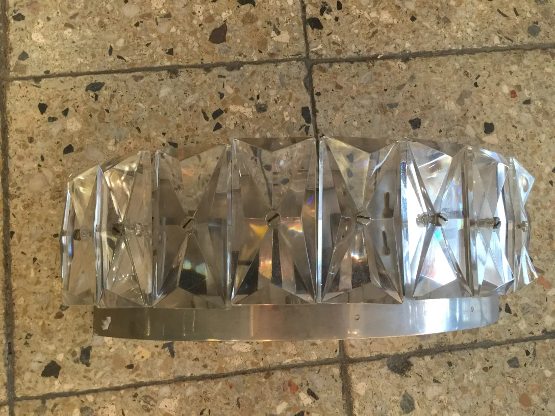 Antique pair of sconces featuring elegant crystal design