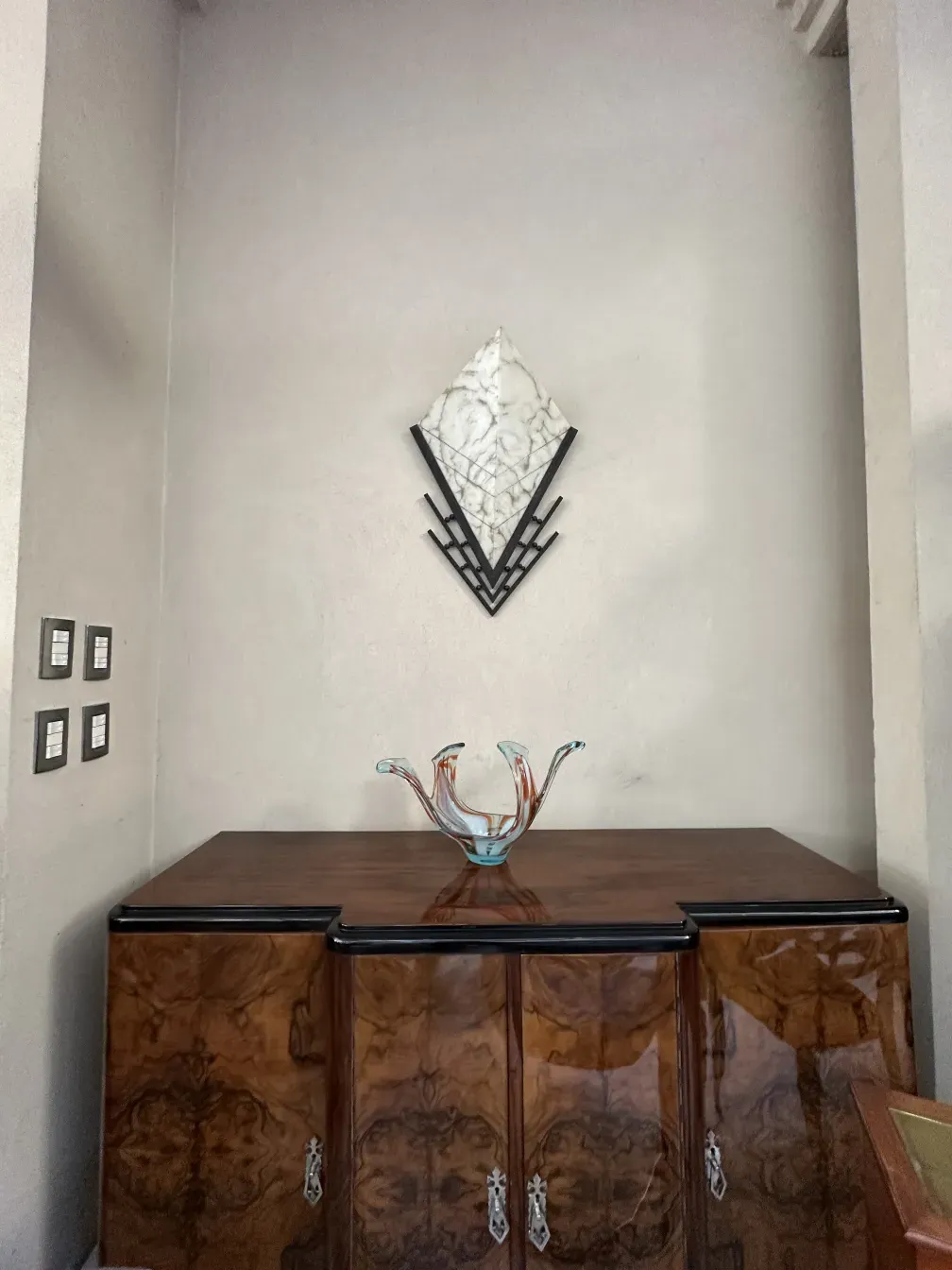 Antique pair of sconces on the wall, stylishly designed