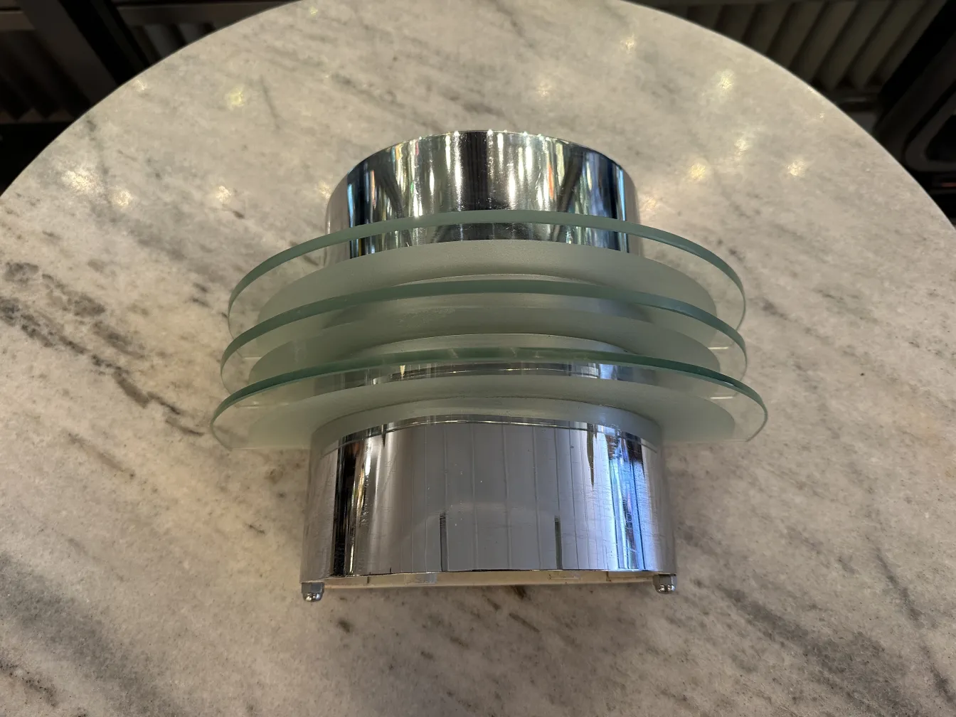 Antique sconces with a sleek modern design on a table.