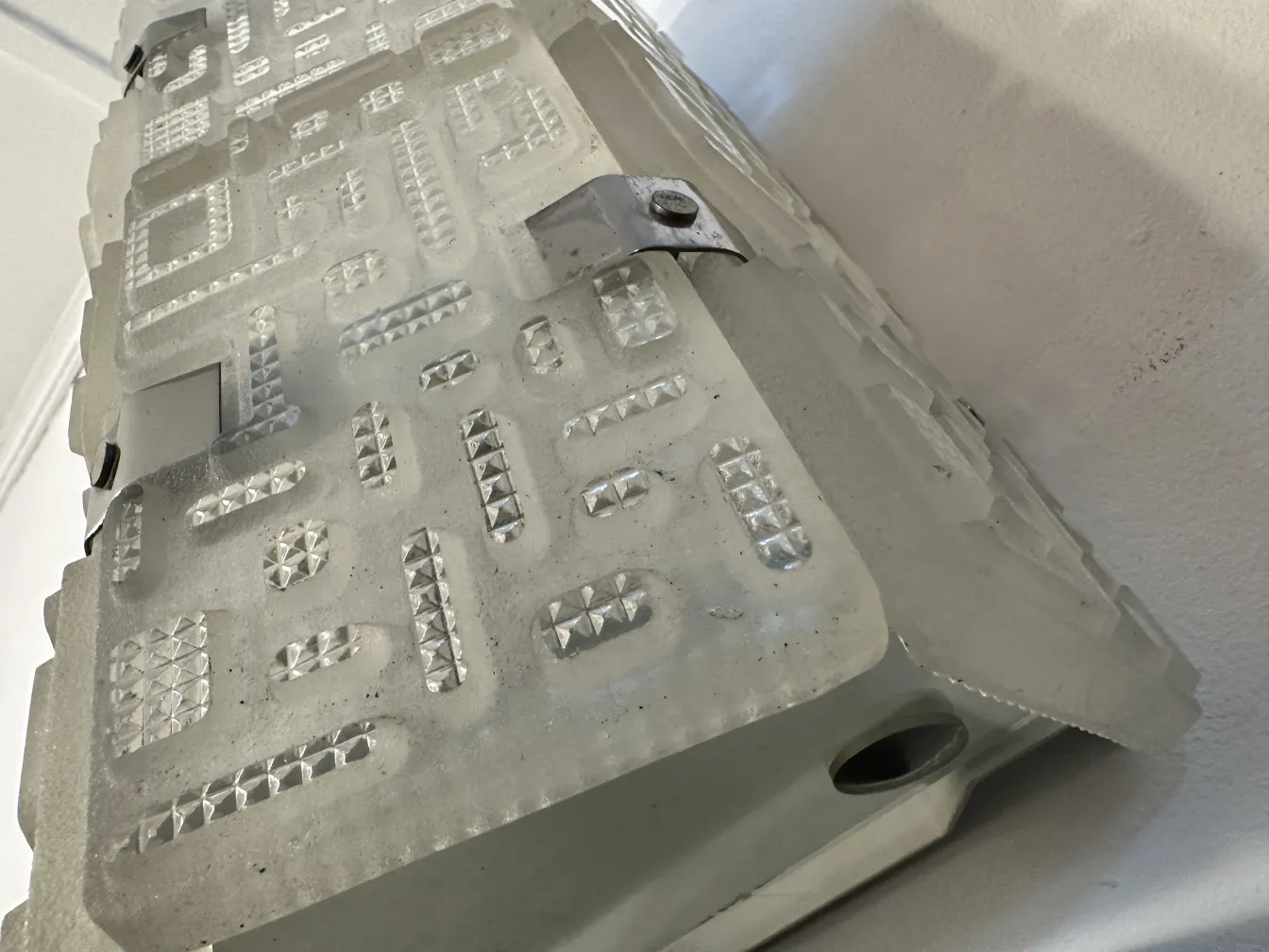 Antique pair of sconces from Orrefors featuring geometric patterns.