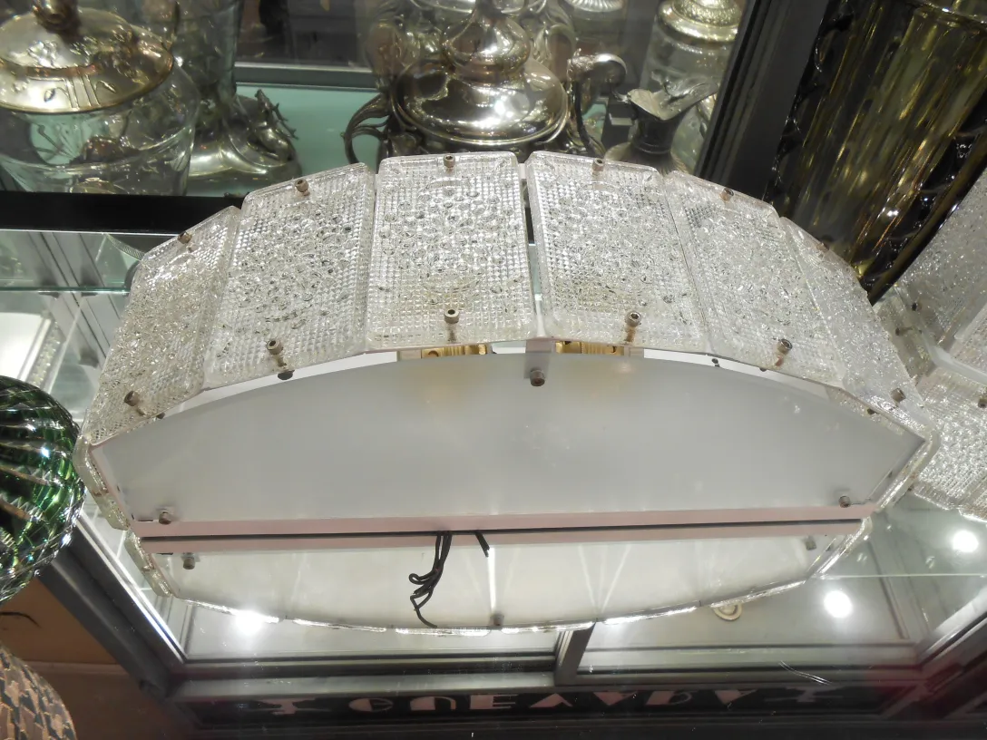 Antique pair of sconces by Orrefors, enhancing a stylish interior.