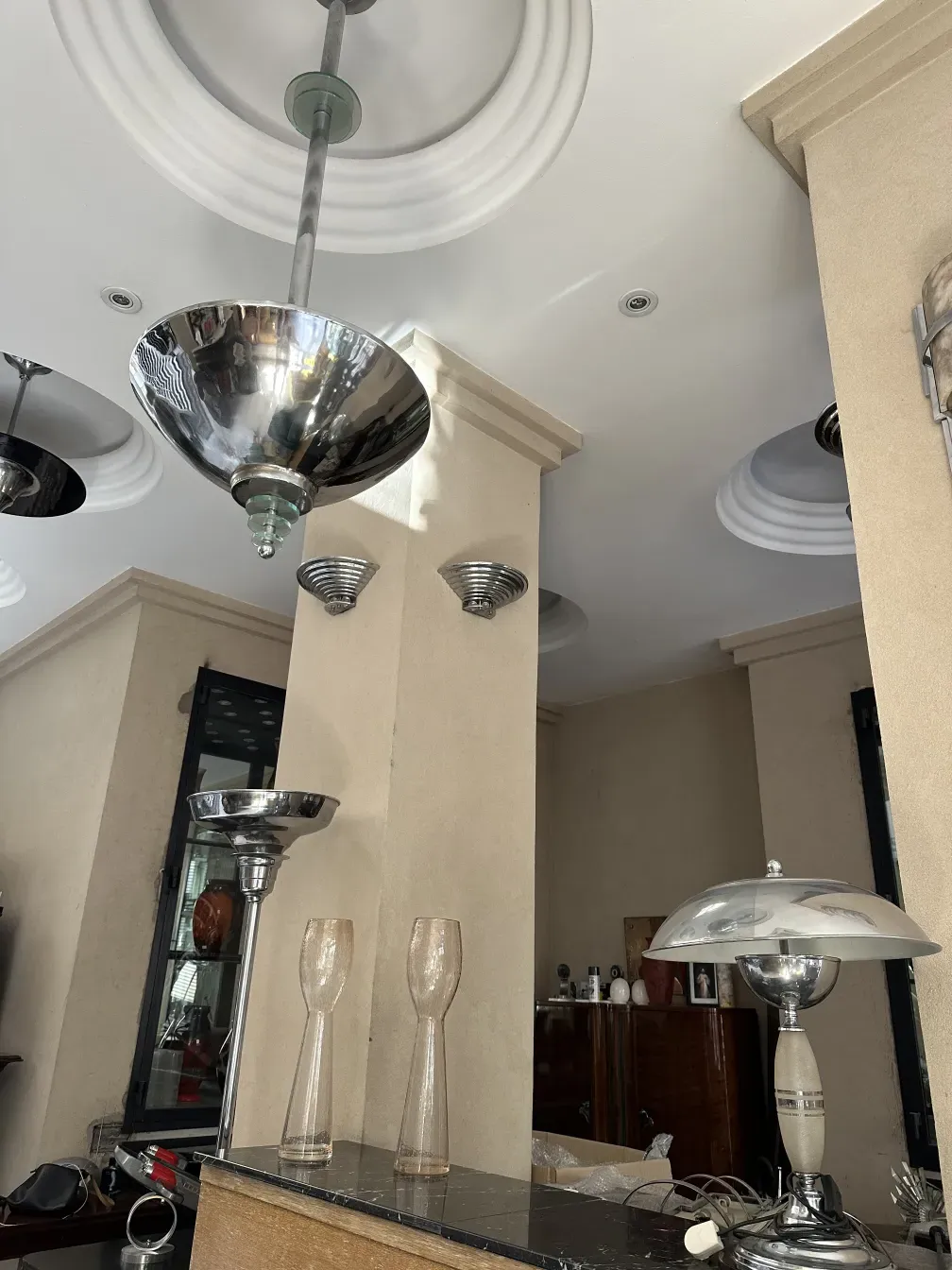 Antique metal sconces with elegant design on the wall