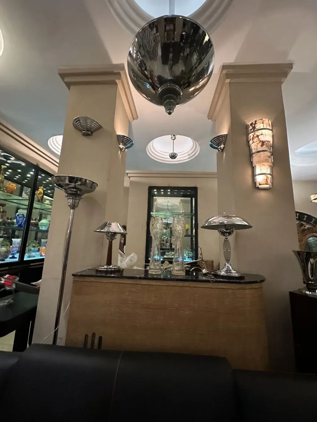 Antique sconces with elegant design, paired with other decorative elements in a sophisticated setting.