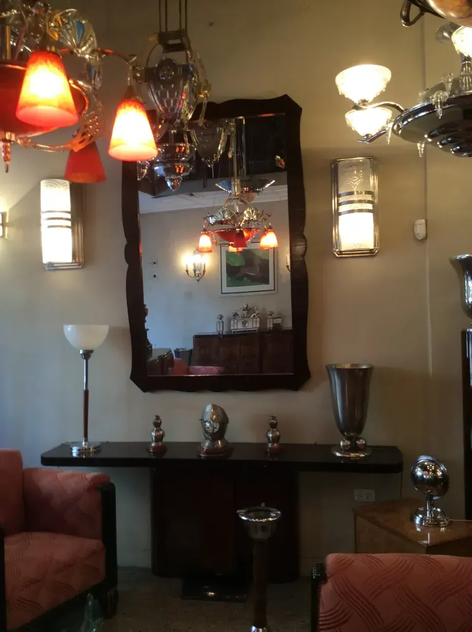 Elegantly adorned with red shades and classic finish, perfect for antique settings.