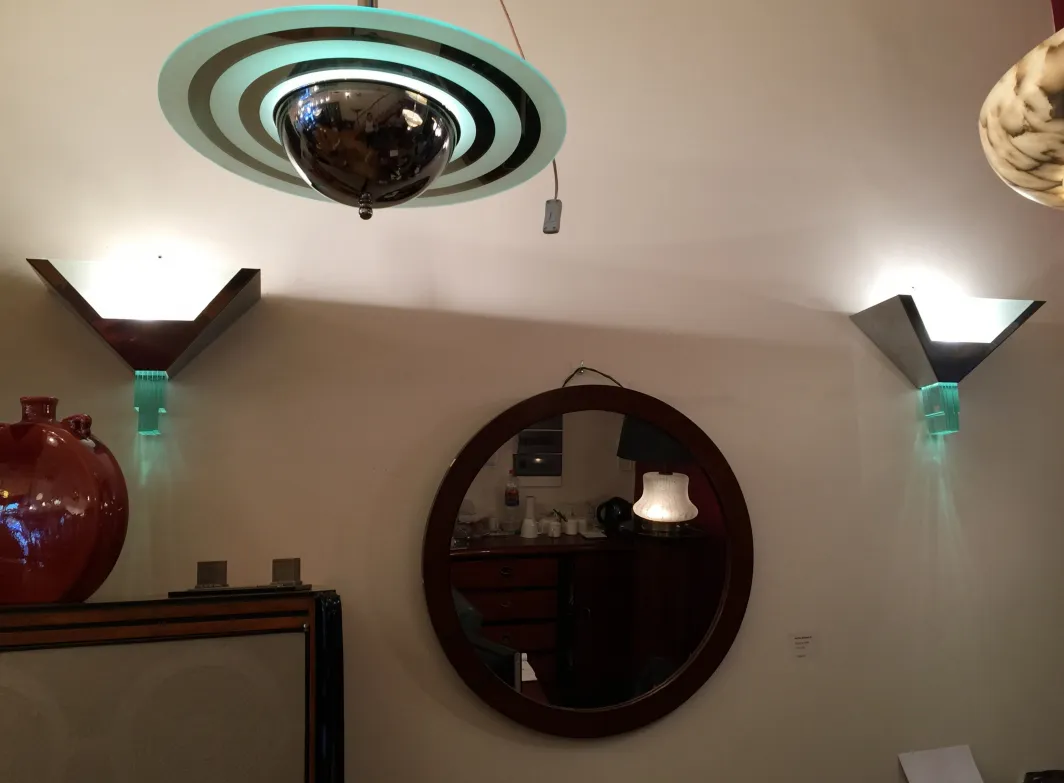 Antique wall sconces with triangular design and ambient decoration