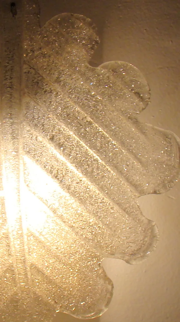 Pair of antique sconces providing warm lighting