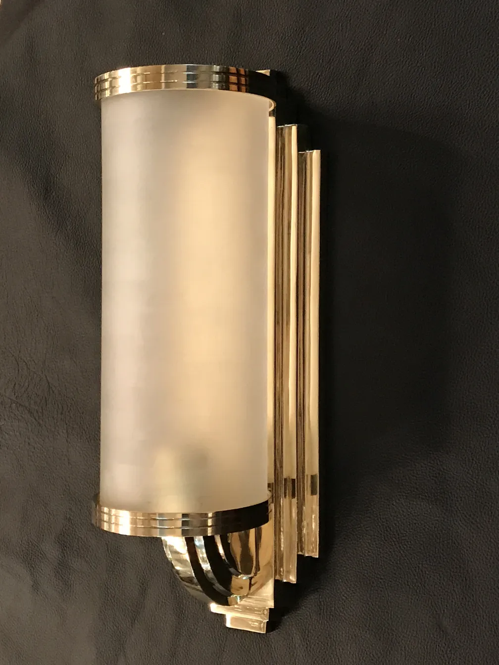 Antique sconces with soft light and elegant design.