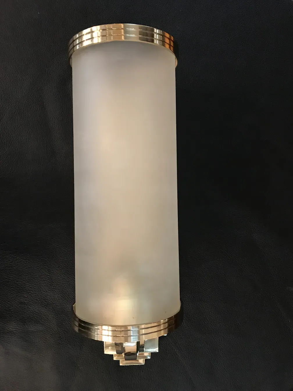 Pair of antique sconces with golden bases and spherical design.