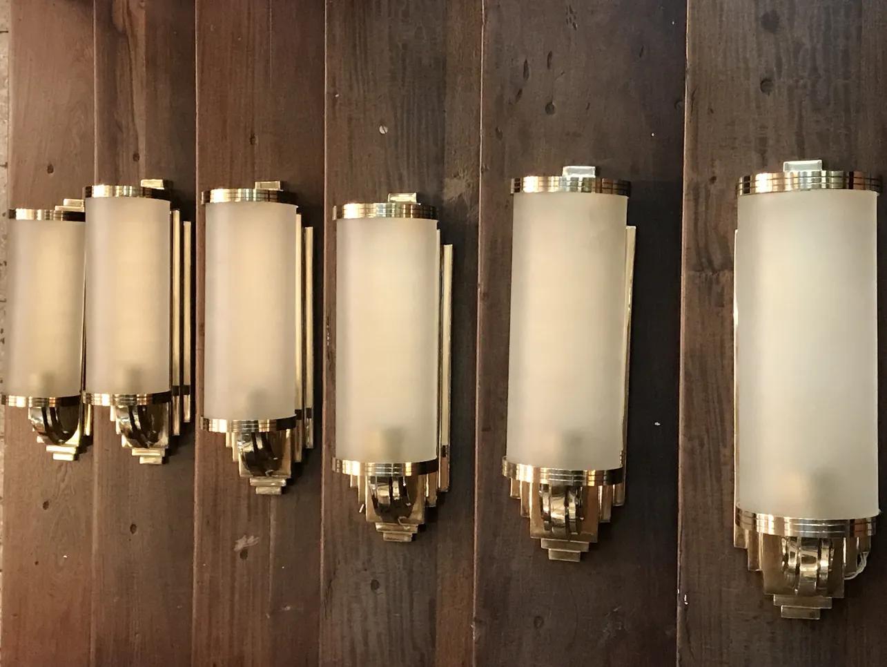 Antique sconces with frosted glass and gold accents