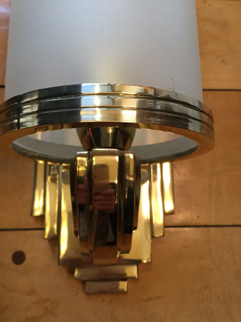 antique sconces with elegant gold design, soft light