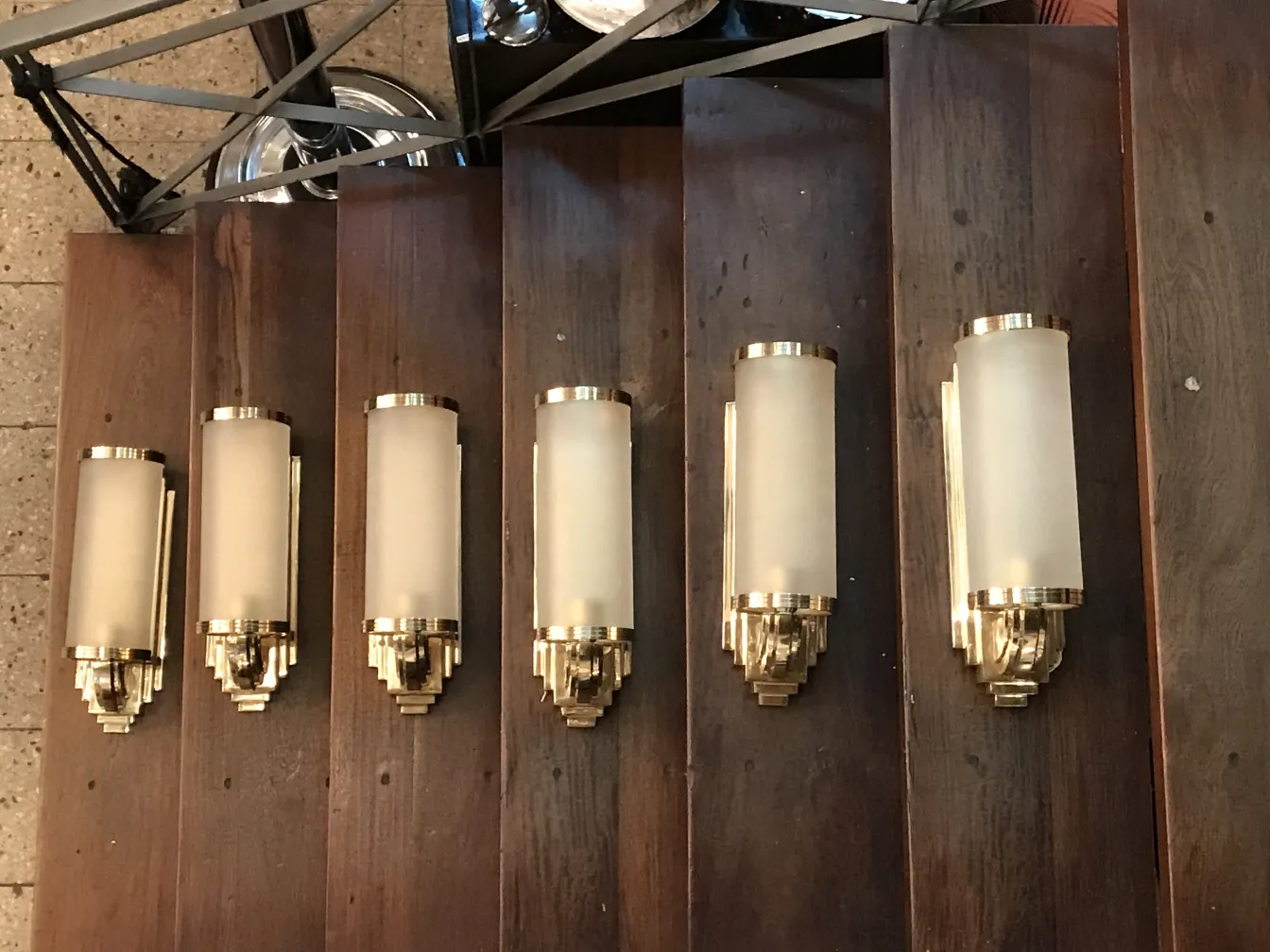 Pair of antique sconces with decorative design in the hallway.