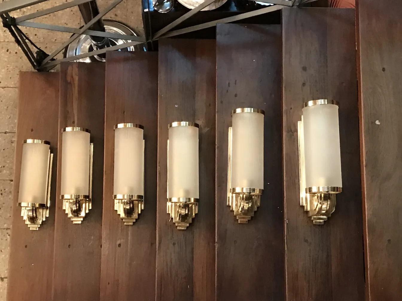 Antique pair of sconces with elegant wall design