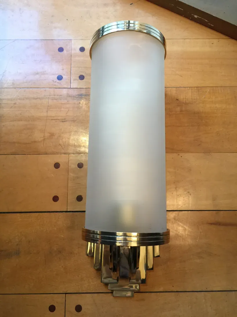 Antique sconces with elegant design and golden details.